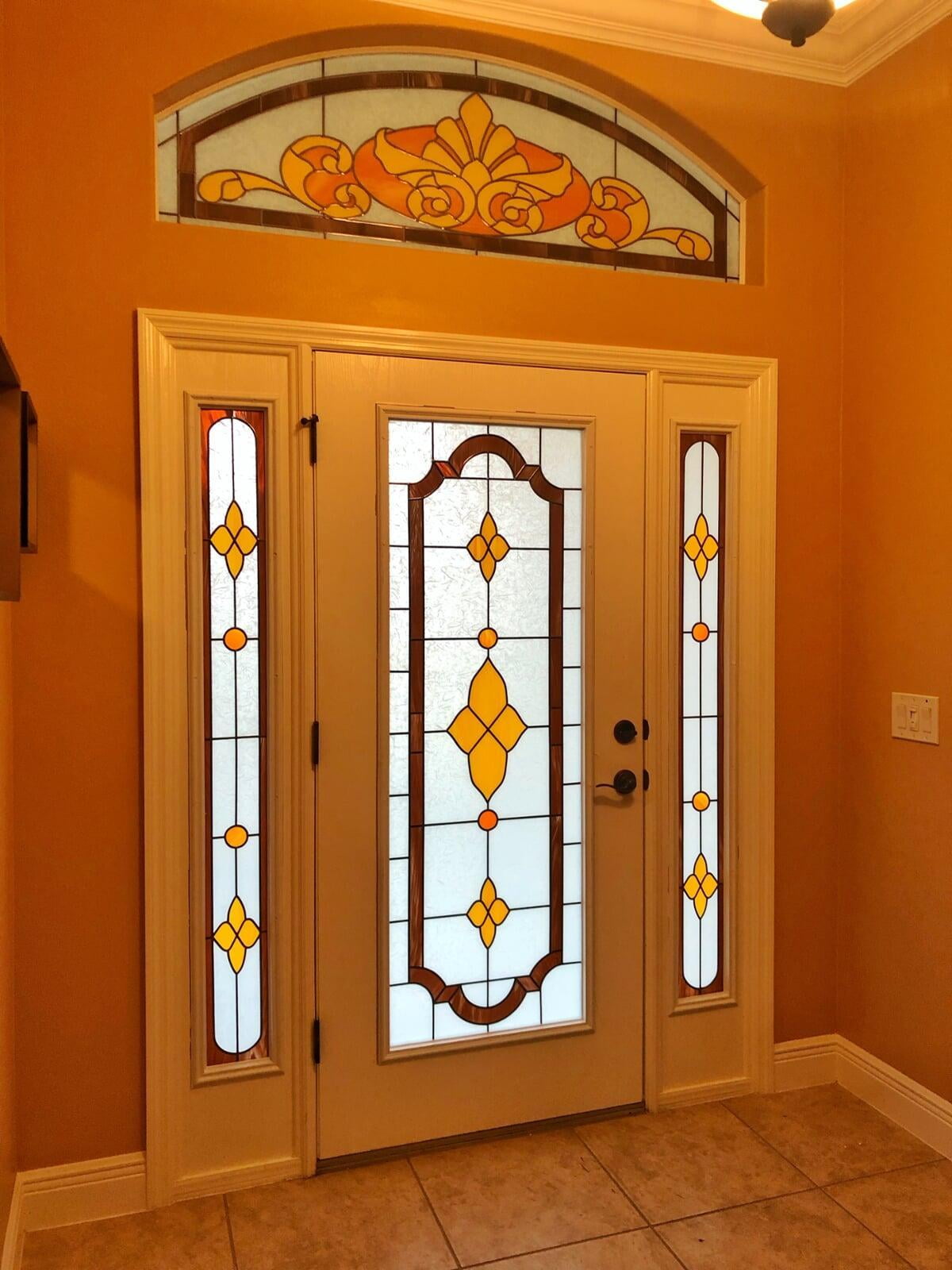 Entry way door, sidelights and transom in traditional stained glass style