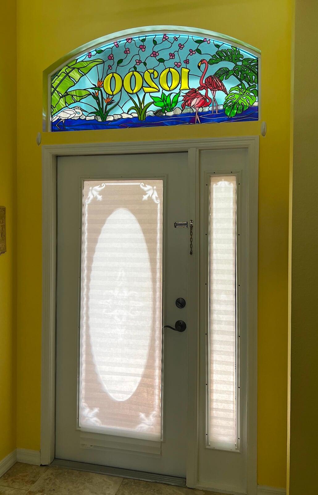Oversized transom in period style bevelled colored glass