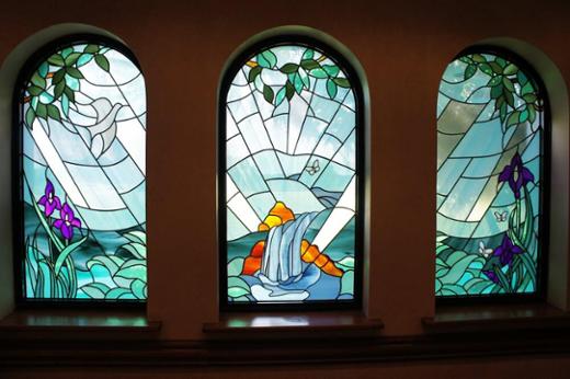 Complementary decorative glass style windows with religious theme